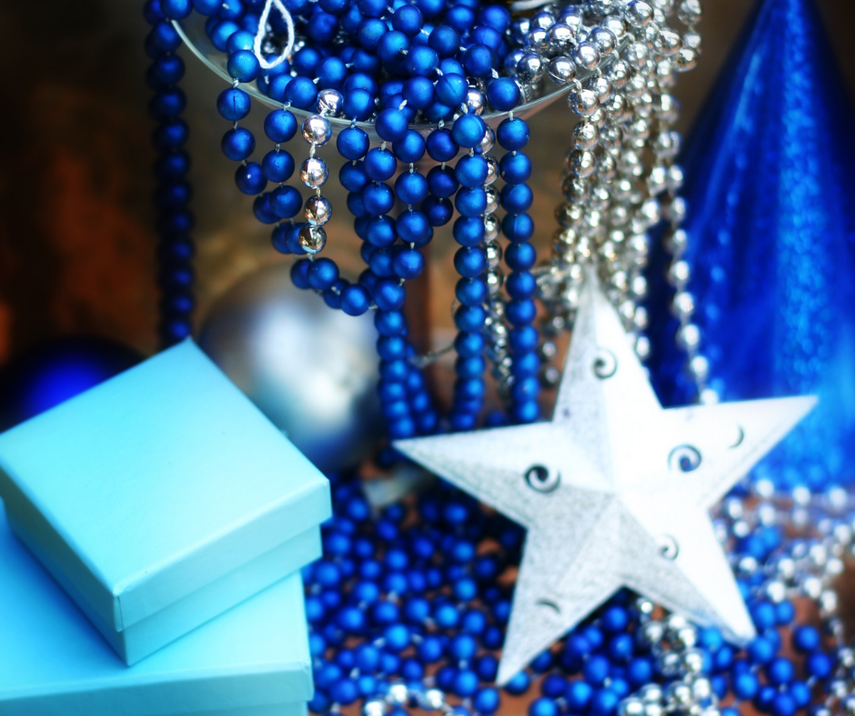 Blue holiday decorations with gift boxes and a star ornament, symbolizing year-end reflection and holiday sales planning.