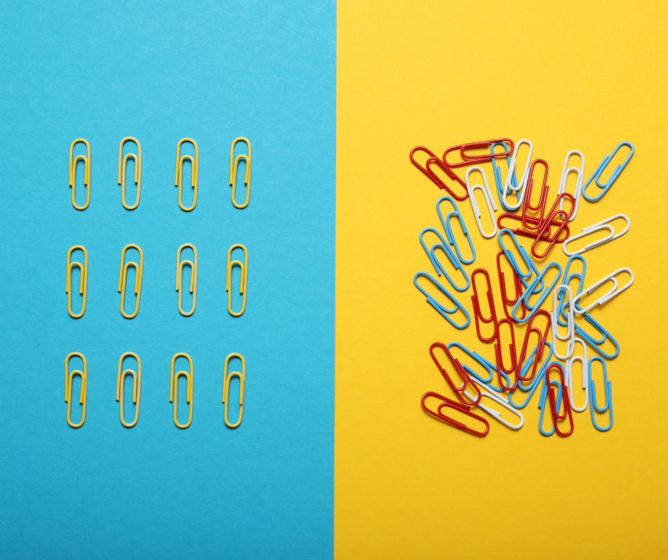 Paper clips arranged in a neat pattern on one side and scattered randomly on the other, illustrating consistency versus inconsistency.