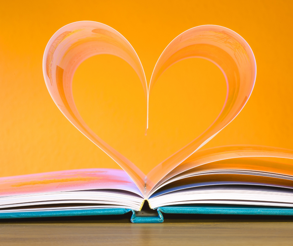 Open book with pages folded into a heart shape, symbolizing learning and growth.