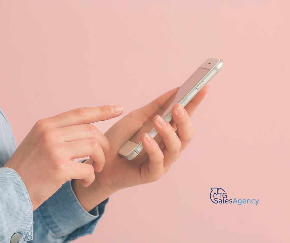 Person using a smartphone to make a call, representing cold call introductions and outbound sales outreach in B2B sales.