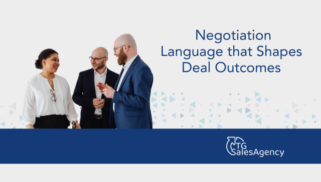 Business professionals discussing negotiation language that shapes deal outcomes