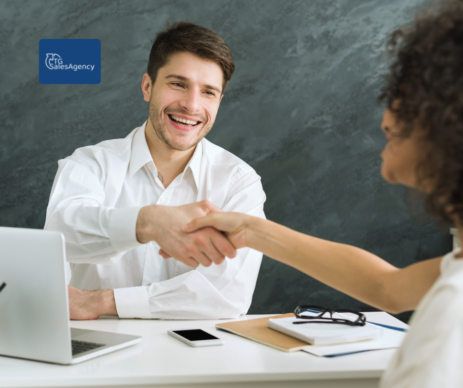 Sales meeting handshake between rep and client, symbolizing trust, closing deals, and post-sale relationship building.