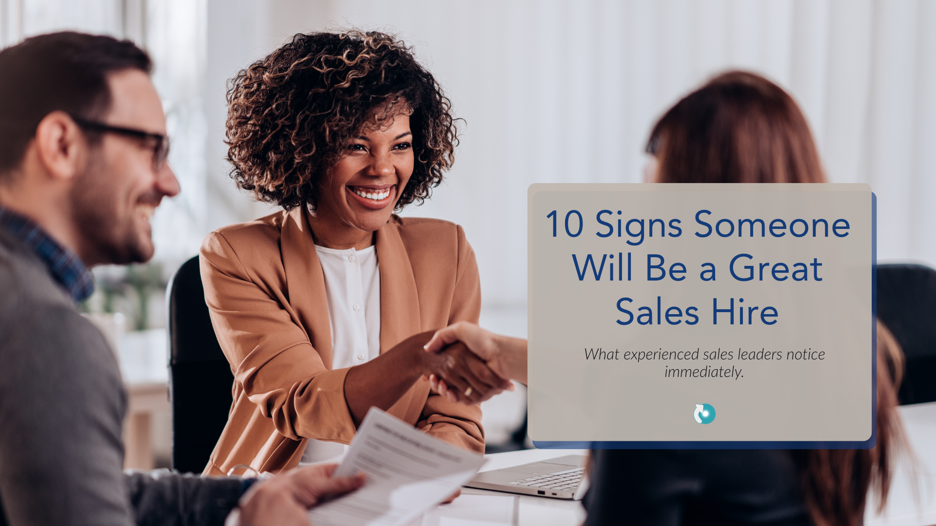 Sales leader interviewing a candidate during a business meeting about identifying great sales hires and avoiding bad sales recruiting decisions.